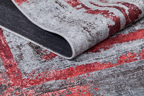 Load image 1 in gallery view. A close-up of the Refined and Timeless - Washable Rug - JR1500 shows its thin, flexible texture, lifted corner with dark backing, and distressed gray and red pattern—perfect for high-traffic spaces.