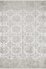 The Regal Embellishment - Washable Rug (JR1590) is a rectangular flat weave rug with light grey and beige tones, showcasing an ornate symmetrical pattern with intricate, faded floral and geometric designs.