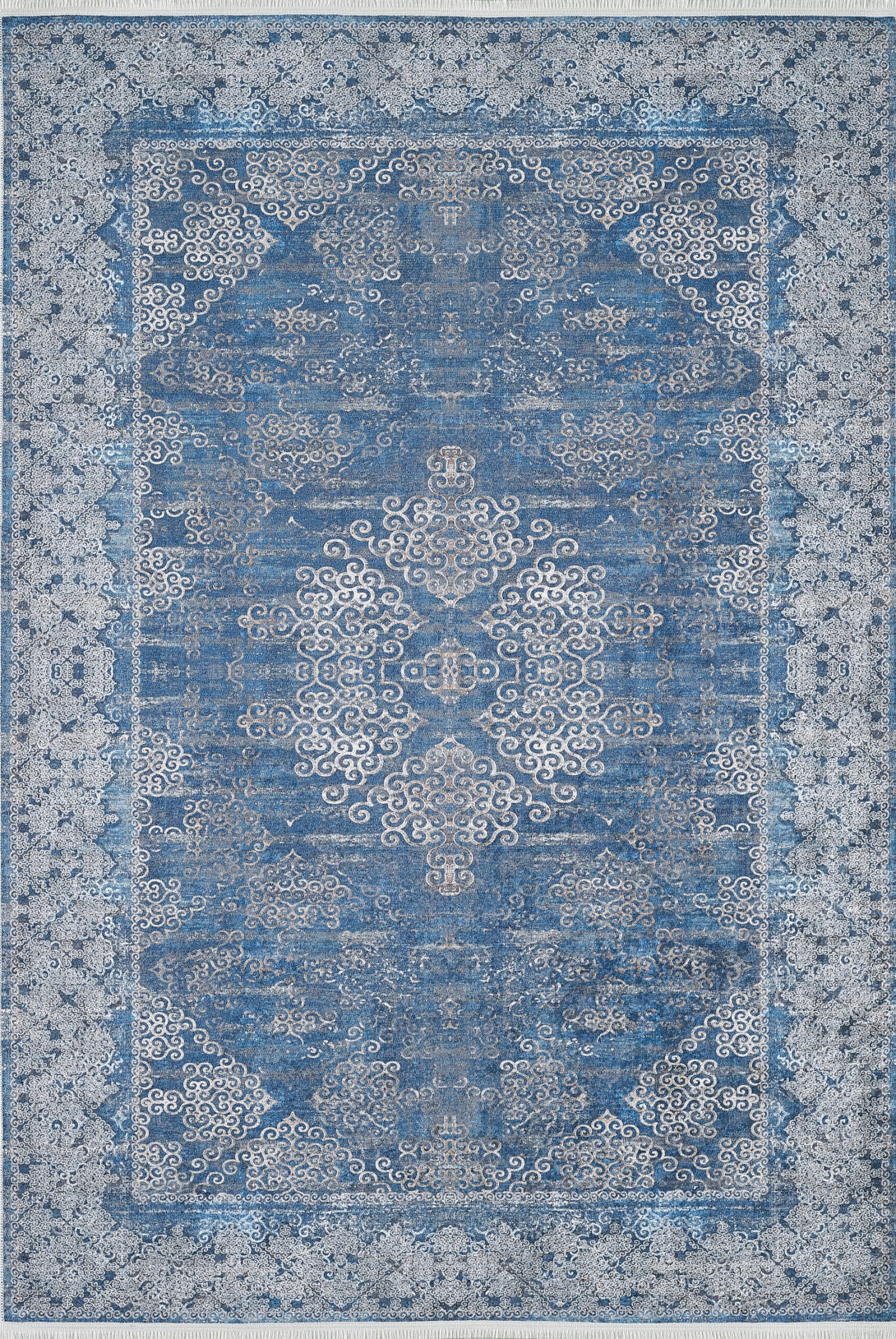 The Regal Insignia - Washable Rug - JR1786 is a rectangular blue rug with an ornate central medallion, swirling motifs, and a floral border. Its traditional design is stylish and practical for high-traffic areas, and it's easy to clean.