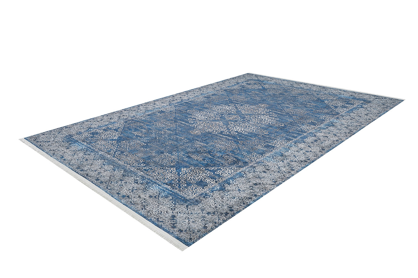 The Regal Insignia - Washable Rug - JR1786 is a rectangular blue and white rug with intricate symmetrical patterns and a decorative border, shown angled on a white background—perfect for high-traffic areas.