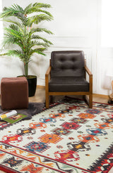 A cozy room corner with a brown armchair, a Rustic Refrain - Washable Rug - JR149 featuring geometric designs, a brown ottoman, a potted plant, and magazines on the floor near a white wall.