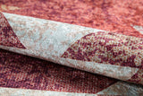 A close-up of the Simplistic Artistry - Washable Rug - JR1647 shows its geometric pattern in red, burgundy, and beige. The soft, durable texture stands out when folded—ideal for high-traffic areas.