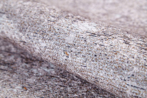 Load image 1 in gallery view. A close-up of the Slate Charm - Washable Rug (JR1740) shows its grey and brown textured surface, resembling stone or bark—ideal for pairing with cream and beige decor in high-traffic spaces.
