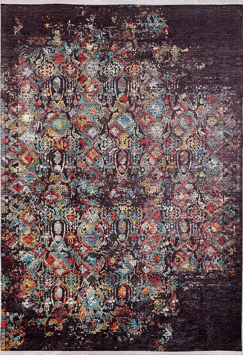 The Soft Haze - Washable Rug - JR1094 is a rectangular rug with a distressed geometric pattern in vibrant red, blue, yellow, and white on a dark background, offering vintage style that’s both washable and allergy-friendly.