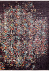 The Soft Haze - Washable Rug - JR1094 is a rectangular rug with a distressed geometric pattern in vibrant red, blue, yellow, and white on a dark background, offering vintage style that’s both washable and allergy-friendly.