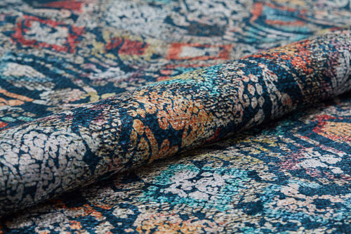 Load image 1 in gallery view. A close-up of the Tarnished Elegance - Washable Rug - JR1095, featuring a multicolored abstract pattern in blue, orange, cream, and red with intricate texture—perfect for high-traffic areas.