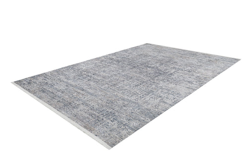 Load image 1 in gallery view. The Timeless Scrollwork - Washable Rug - JR1774 is a rectangular gray-anthracite rug with a muted grey and blue pattern, shown angled on a white background—ideal for high-traffic areas.