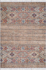 The Tribal Tango - Washable Rug - JR5089 is a rectangular rug with geometric and floral patterns in bronze, brown, blue, and red tones. Its fringed edges and machine-washable design make it ideal for high-traffic areas.
