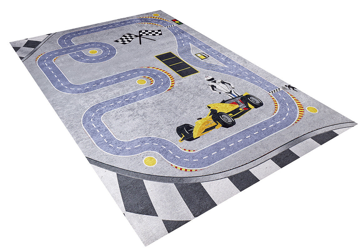 The Turbo Tracks - Machine-Washable Rug JRC089 is a rectangular, washable rug featuring a winding racetrack with a yellow race car, checkered flags, and road details on a gray-anthracite background for stylish durability in high-traffic areas.