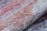 Close-up of the Vintage Brushed - Washable Rug - JR143, a flat weave with a soft, velvety surface in gray, red, and blue tones, featuring a subtle abstract pattern and a slightly reflective finish.