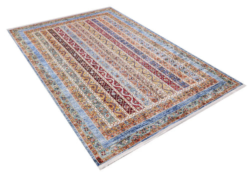 Load image 1 in gallery view. The Vintage Vibes - Washable Rug - JR37 is a large rectangular multicolor Persian-style rug with red, blue, gold, and beige geometric and floral patterns. It features a wide blue-orange border and is pictured at an angle, perfect for high-traffic areas.