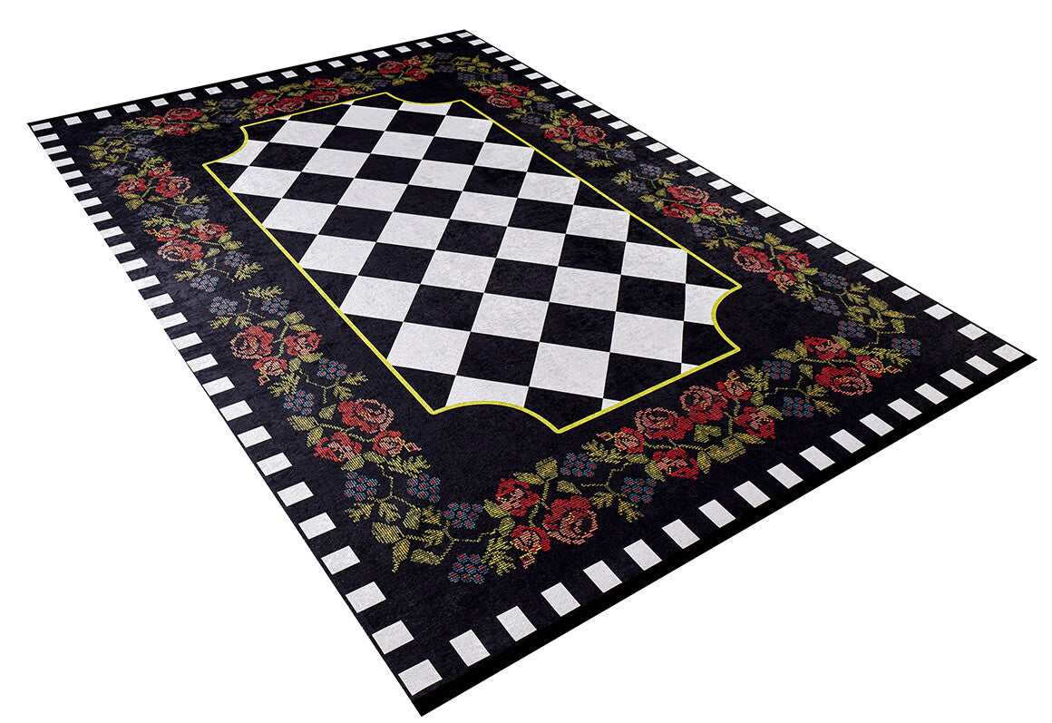 The Wildflower Wonderland - Washable Rug - JR587 is a rectangular flat weave rug with a central black and white diamond checkerboard, bordered by red and green florals on black, finished with a white and black checkered edge.