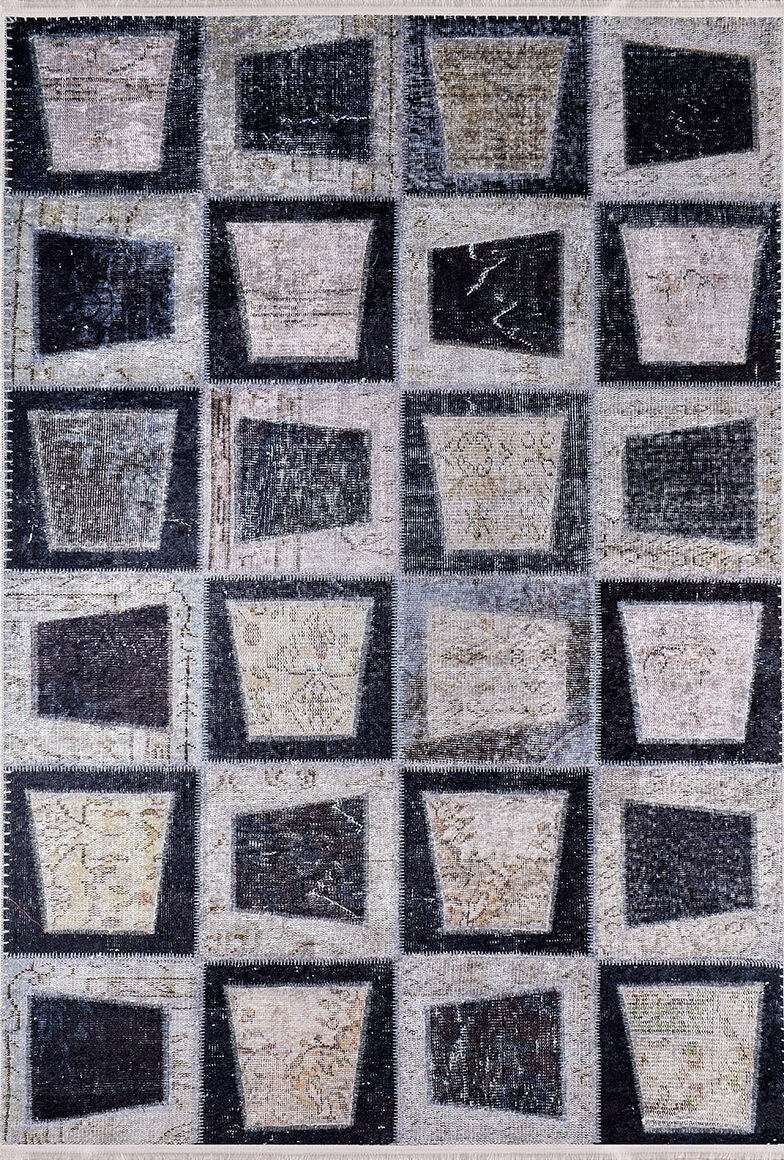 The Windowpane Wonder - Washable Rug - JR184 features a gray-anthracite grid of square blocks with trapezoid and bucket-like shapes in black, gray, and beige for a geometric, abstract look that's easy to care for.